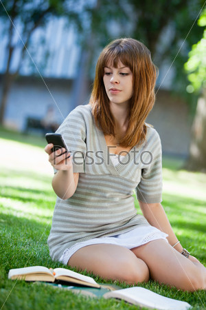 Young girl using cell phone