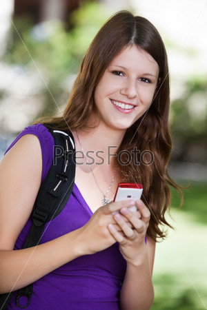 College girl holding cell phone