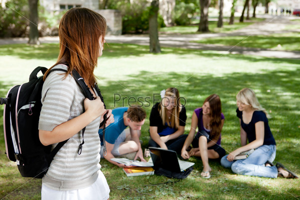 A group of university students stuying together with one student in foreground