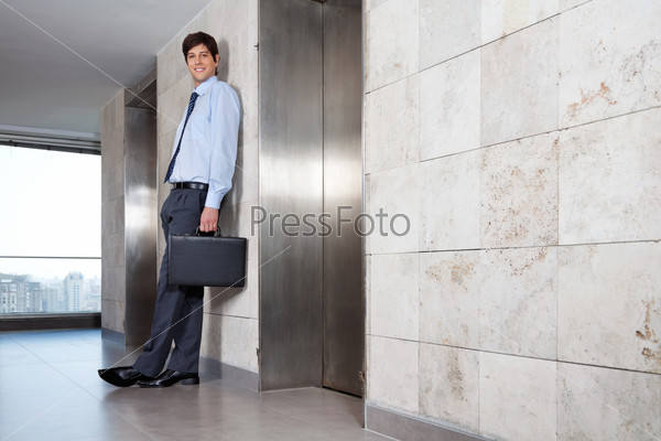 Handsome Corporate Manager Standing Near Lift