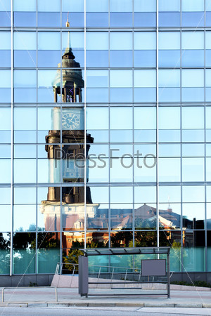 Old and modern Hamburg. St. Michael\'s Church reflects in modern office building