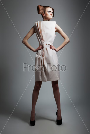 Fashion style - elegant lady with beautiful hairstyle isolated on grey background