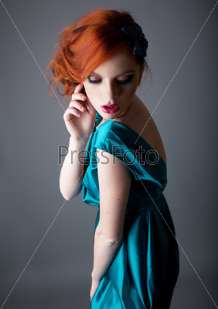 Emotions - red hair freckled bright beautiful young woman posing Studio shot
