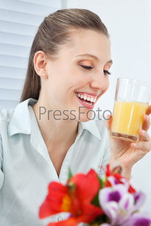 Jovial Businesswoman Holding Orange Juice