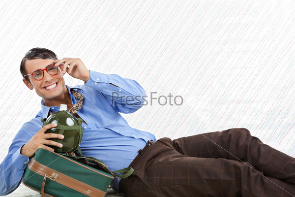Businessman Lying With Travel Bag