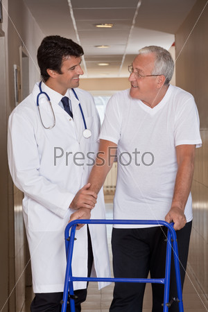 Doctor helping Patient use Walker
