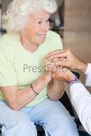 Doctor Comforting Senior Woman