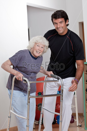 Therapist helping Patient use Walker