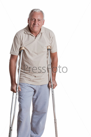 Senior man with crutches and females doing physical\
exercise