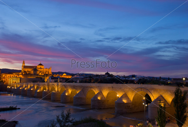 old cathedral and roman bridge at sunset, Cordoba, Andalusia, Spain