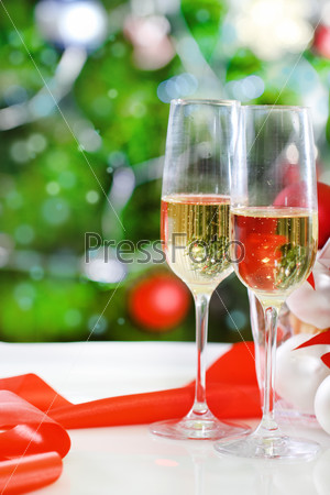 Glasses of champagne and Christmas decorations