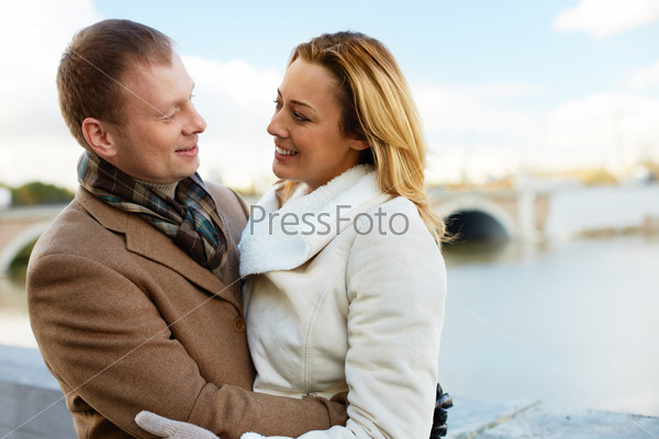 Portrait of affectionate couple having good time outside, stock photo