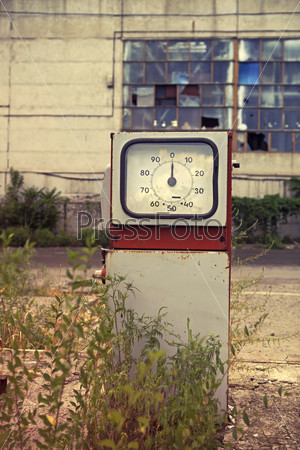 Damaged gas station close up in retro style