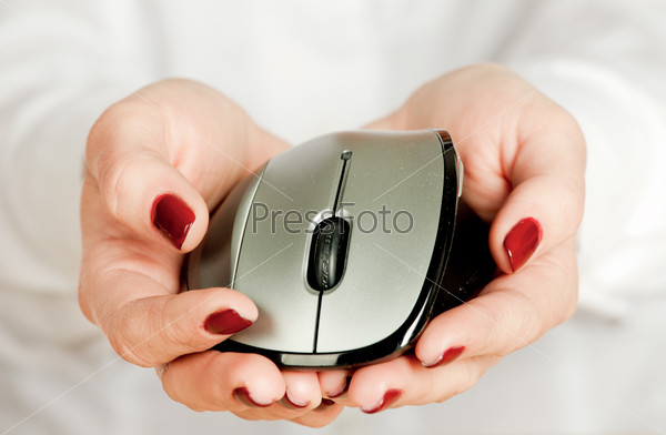 Isolated hands taking a computer mouse