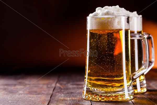 photo of traditional german beer glass on wooden table