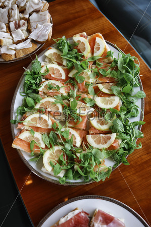 Italy, Elba island, fresh salmon appetizer served with salad and bread