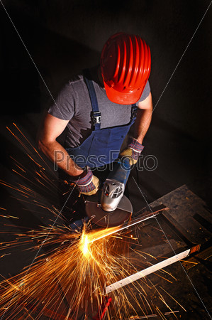 manual worker work in factory with grinder