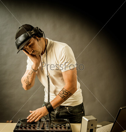 DJ with mixer is working , photo with copyspace