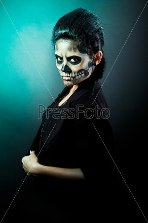 Woman in day of the dead mask skull face Halloween face art, stock photo