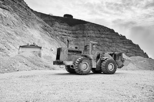 Stone pit with industrial vehicle at work