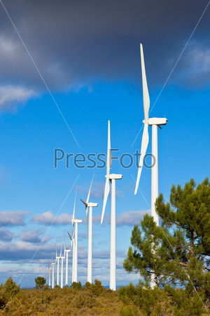 Wind turbines on a wild field in Spain. Vertical shot