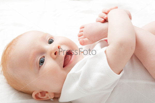 Cute Baby Girl Lying on Back on White Background