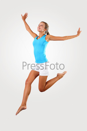 Fitness woman jumping excited