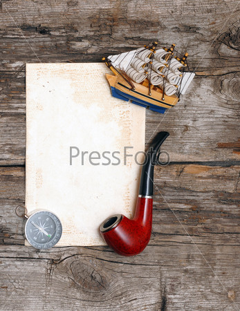 Pipe, old paper, compass and model classic boat