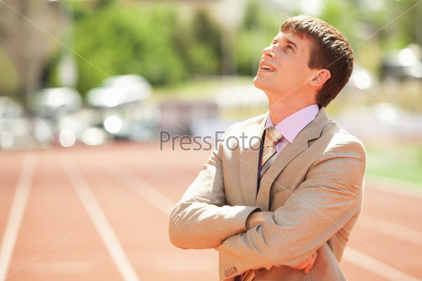 Businessman at athletic stadium and race track
