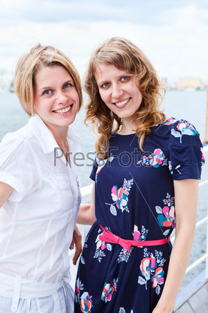 Two sexy women on vessel deck together