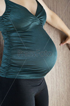Pregnant woman belly before soon coming child birth