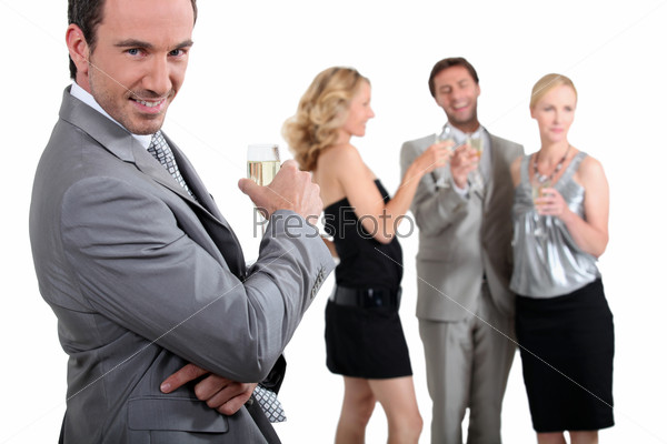 Colleagues drinking champagne, stock photo