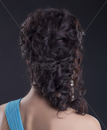 Beautiful woman brunette - long hairstyle on black background