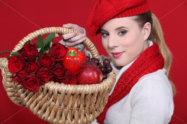 lovely blonde carrying basket filled with red and dressed to match