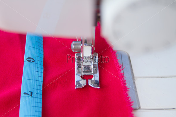 Measuring tape and needle of sewing machine