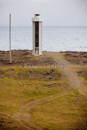 Lighthouse in East Iceland. Vertical Toned shot