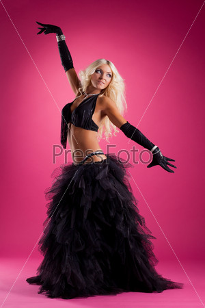 athletic blond woman posing in east style costume