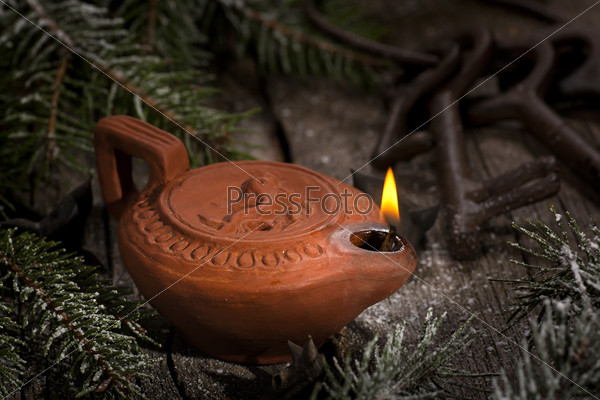 Ancient oil lamp still-life
