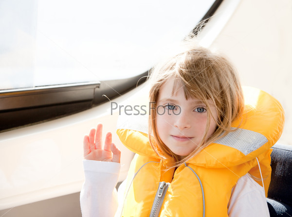 blond kid girl with marine yellow lifesaver jacket in a boat interior