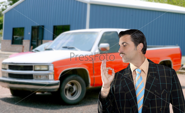 car used salesperson selling old car as brand new  typical topic salesman with hand ok gesture [Photo Illustration]