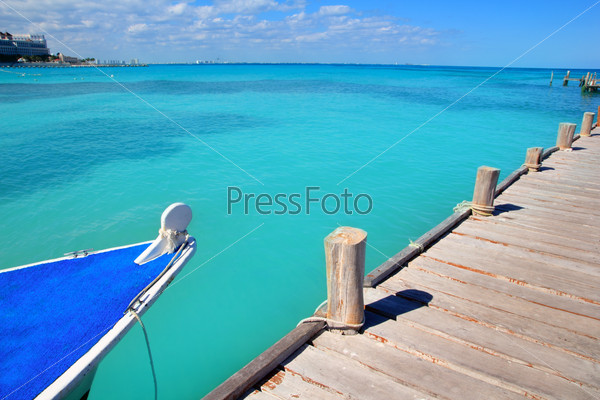 Boat in wood pier Cancun tropical Caribbean sea