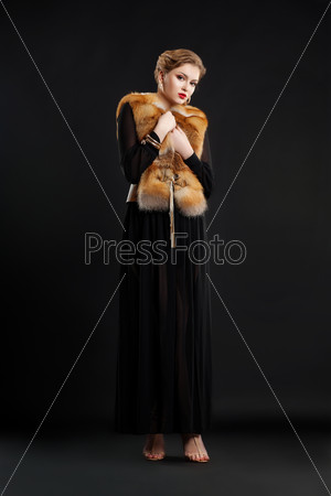 Woman in Black dress and Fox Fur Mantle - Glamour