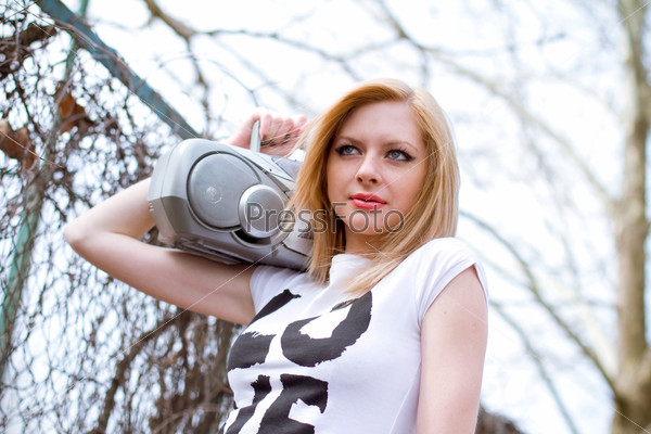 Girl with tape recorder, stock photo