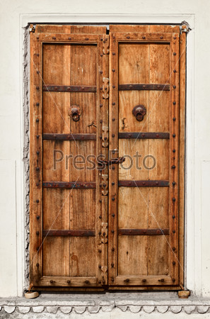 An old dilapidated wooden door of Indian home