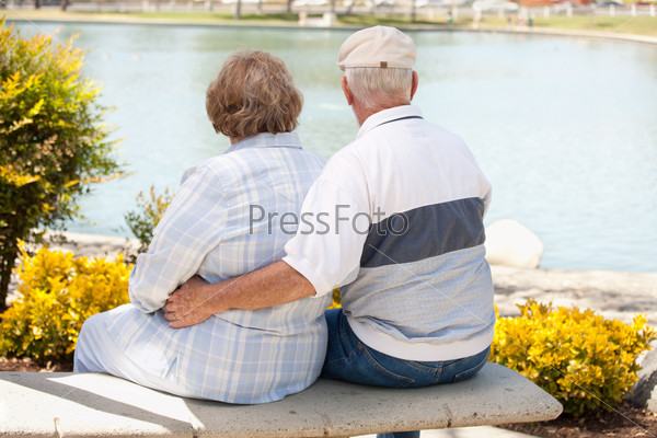 Happy Senior Couple Enjoying Each Other in The Park, stock photo