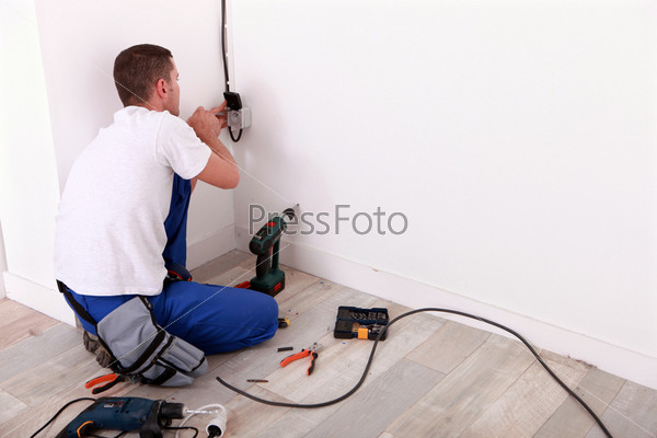 Electrician repairing wiring, stock photo