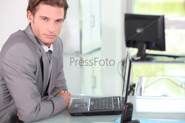 Young businessman on laptop