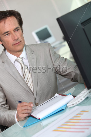Executive working at computer