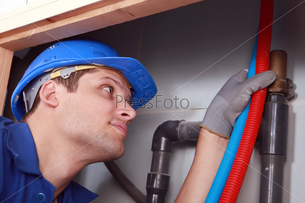 Plumber with hot and cold flexible water pipes