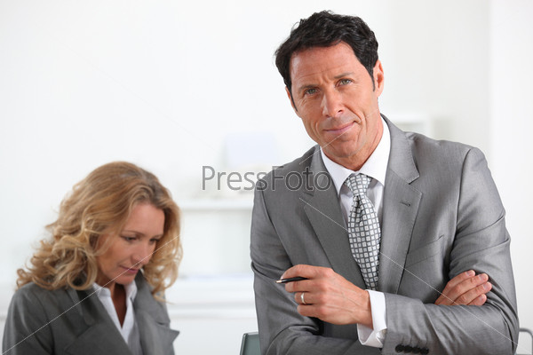 Company colleagues working, stock photo